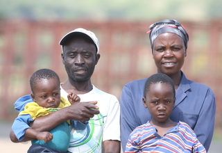 Laina Mutenga, her husband and two of their four children at Forefront Farm