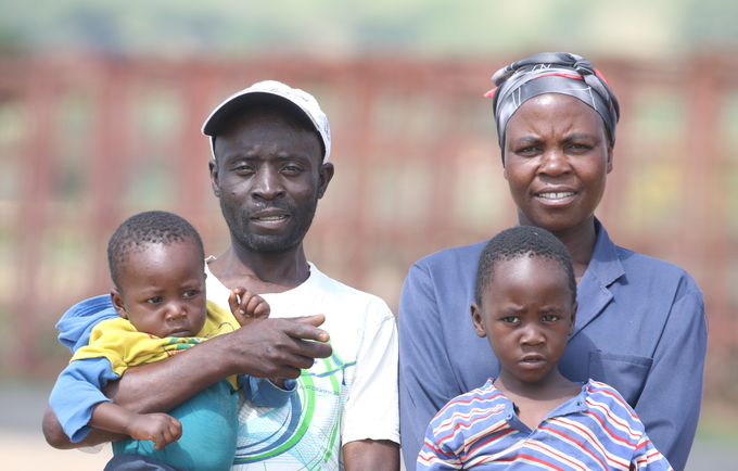 Laina Mutenga, her husband and two of their four children at Forefront Farm