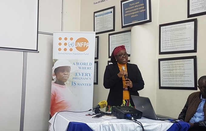 UNFPA Representative Dr Esther Muia speaking at a media briefing to mark World Population Day