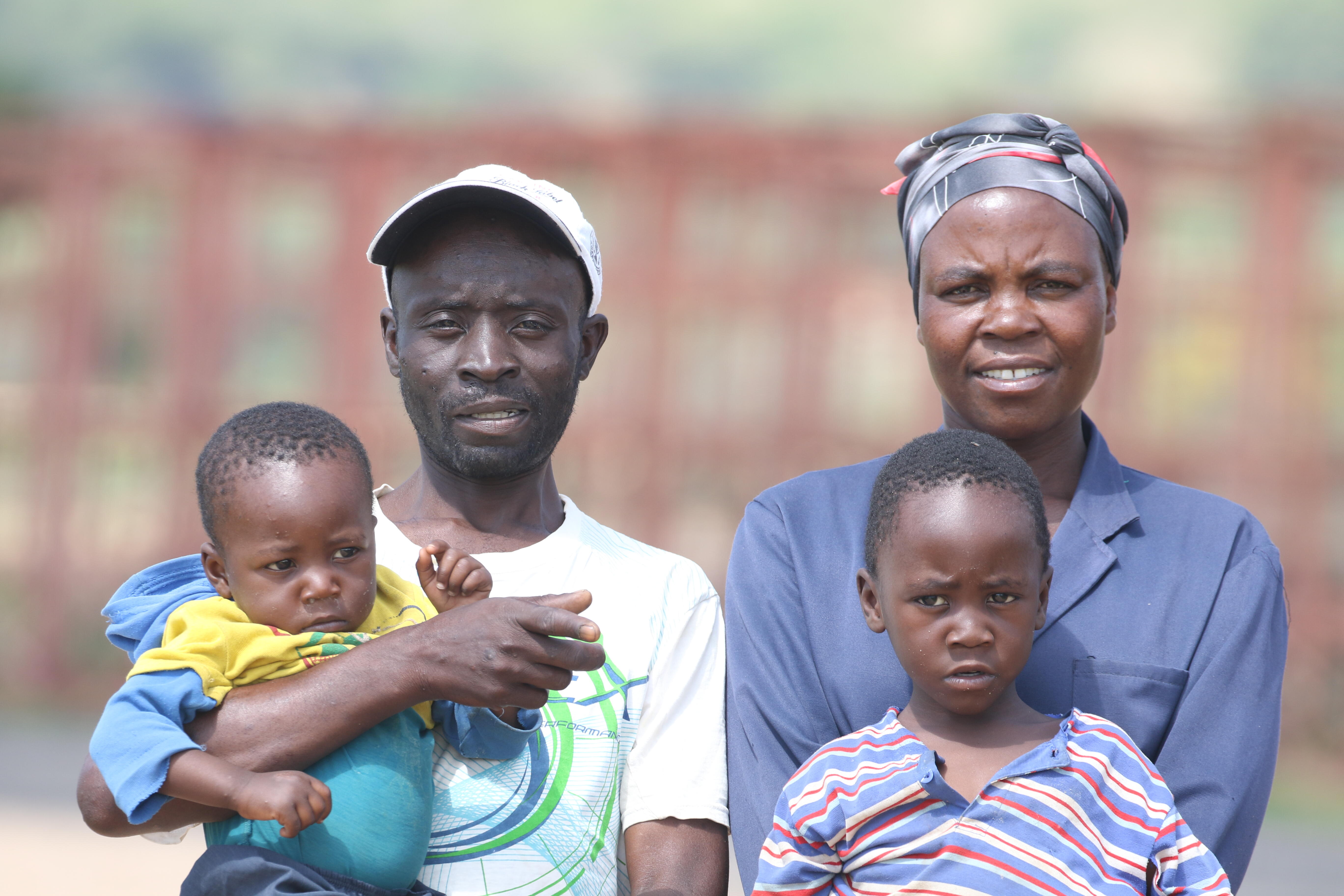 Laina Mutenga, her husband and two of their four children at Forefront Farm