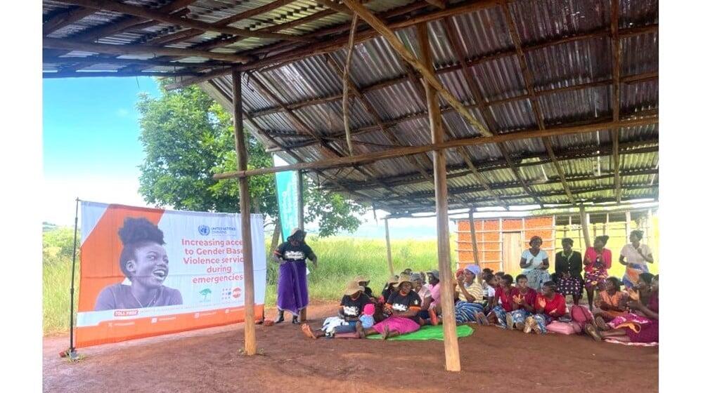 Safe Space Peer Facilitator engaging women and girls in her community in a session on the forms of GBV and the referral pathway 